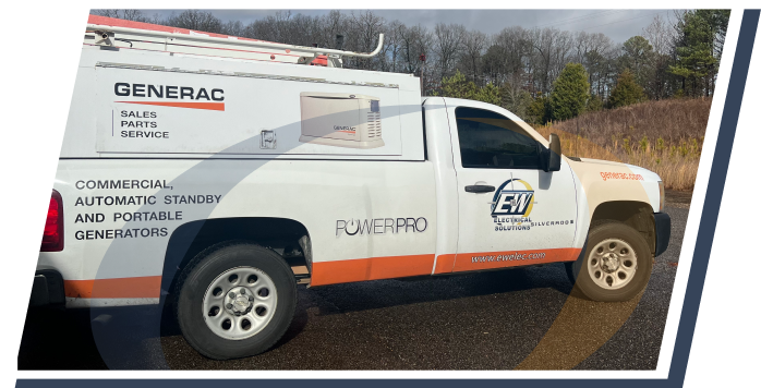 A truck with the E&W electrical solutions logo on the side
